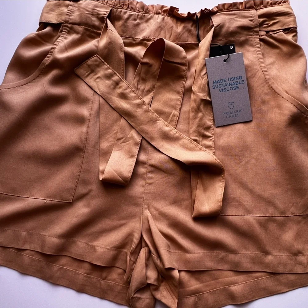 Dress shorts, yellow size 8 . PRIMARK CARES
